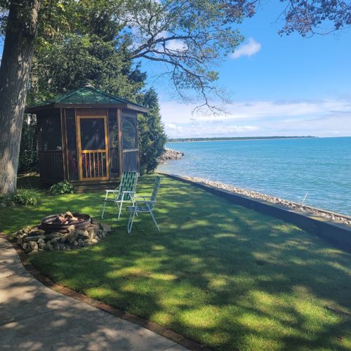 Exterior:  another view of the private lakefront, showing the private bonfire ring and private gazebo