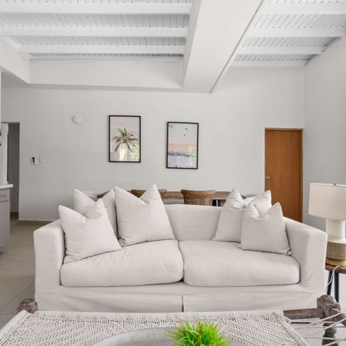 Relax in comfort. Plush sofa and modern decor for a cozy stay.
