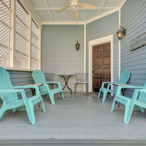 Classic New Orleans porch w/ turquoise chairs made for lazy morning sips.