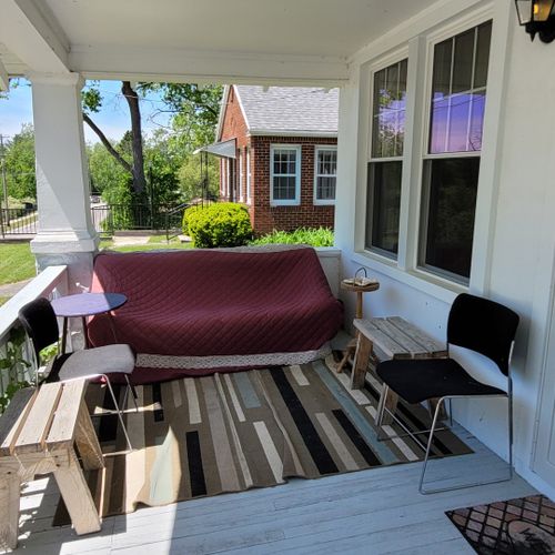 Exterior:  the cozy front porch, which faces south towards the au sable river