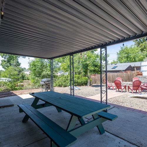 Alfresco meals feel magical in this breezy outdoor dining setup.
