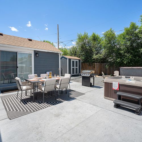 Soak up the season with a tub and patio made for relaxing.