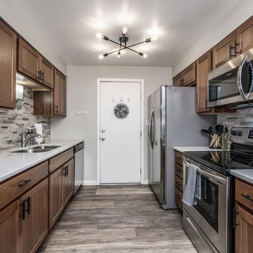 - well equipped kitchen with dual counters generous storage and sleek finishes
- modern lighting and tasteful backsplash add a touch of designer style
- clean bright layout makes cooking snacking or prepping a true pleasure