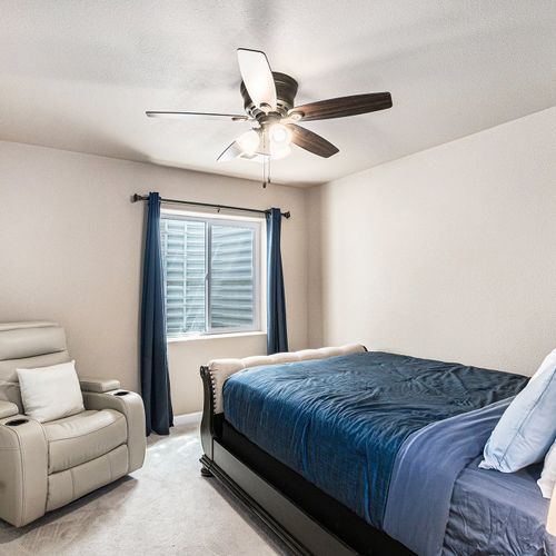 Second bedroom furnished with cozy bedding. There is ample closet space for your wardrobe and belongings.
