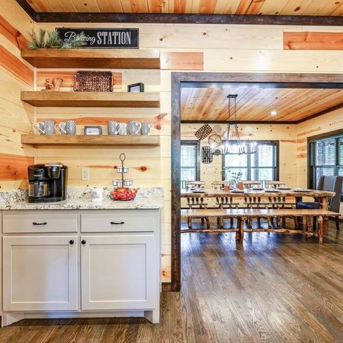 Sleek floating shelves and a coffee bar with a Keurig + regular drip.