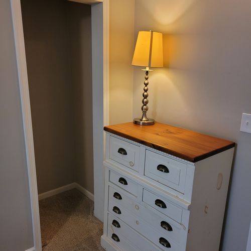 Bedroom #2:  features a twin-on-twin bunk bed, dresser, closet, and lamp