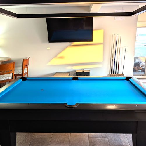 GAME ROOM (LOWER LEVEL):  The home has an incredible game room on the lower level with a championship pool table and large screen television.