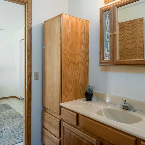 Downstairs bedroom has its own bathroom with shower and bathtub.