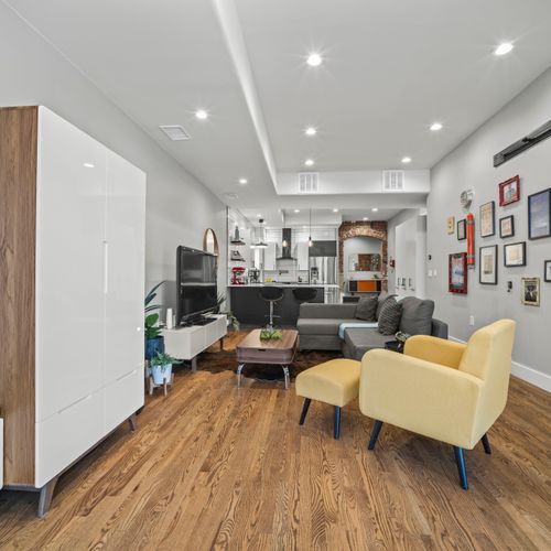 Living room and kitchen flow together in a bright, open layout.