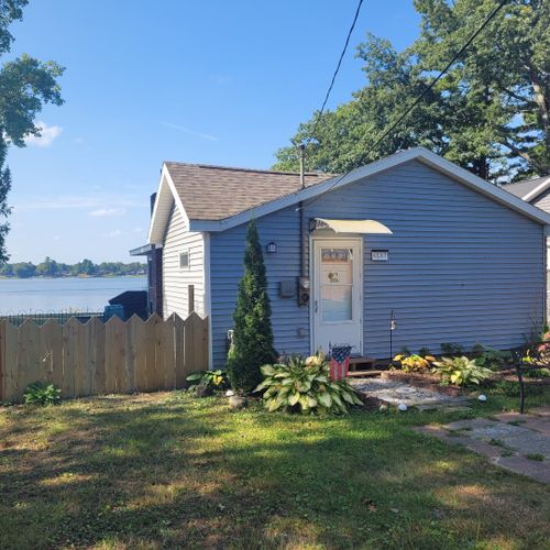 Overall:  the front of the house with van etten lake in the background.