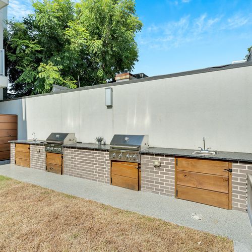 Fire up the grill in this spacious outdoor BBQ area, perfect for a cookout.