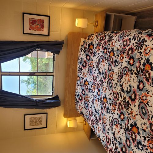 Bedroom #1:  features a queen-size bed, nightstands, lamps, mirror, and closet.
