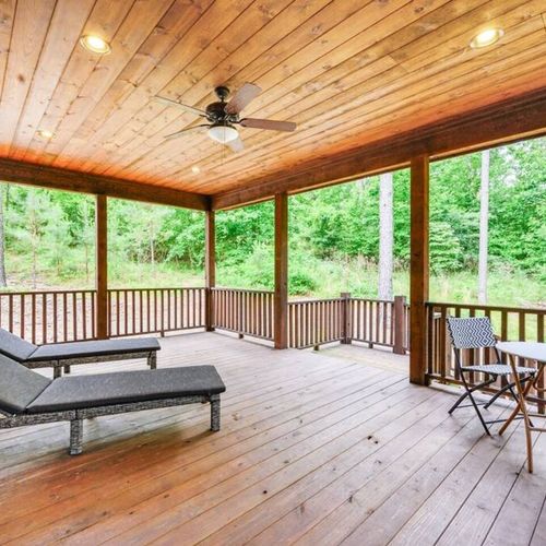 Access from the Master, lounging chairs on the covered patio.