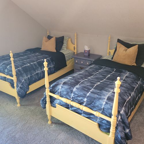 BEDROOM #4 (SECOND FLOOR):  Features 2 twin beds, a closet, a chair, and private live-streaming television.