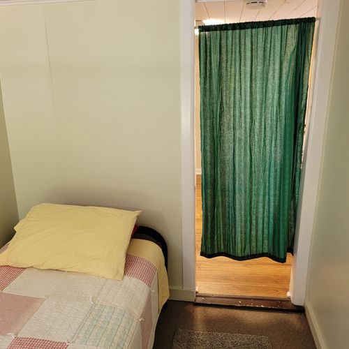 Bedroom #2:  features 2 twin-size beds. (note that there is no door to the bedroom. There is only a curtain. )