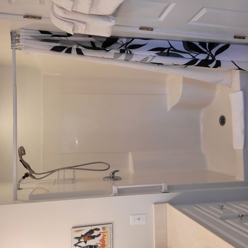 Bathroom #2 (upper level):  full bathroom that is a private en suite bathroom for bedroom #2