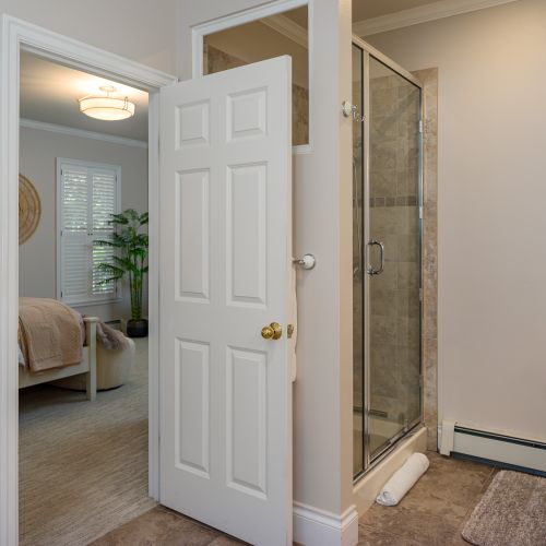 Enjoy a separate, custom-tiled shower in the main bedroom.