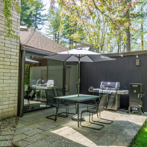 Cook something up on the Weber grill and dine al fresco on this lovely little patio.