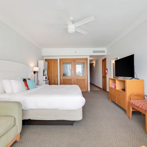 Relax and unwind in a beautifully appointed space with a comfortable king-size bed and a large flat-screen TV for your entertainment.