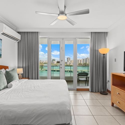 Wake up to breathtaking lagoon views from your comfortable bed, a truly serene experience.
