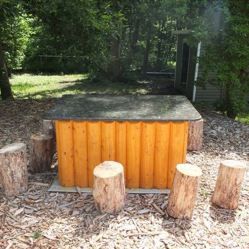 Exterior:  a closer view of the beautiful outdoor dining table that was handmade by the previous owners from poland.