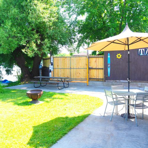 Exterior:  the backyard looking towards the the turk lake restaurant & bar that is next door to the house.