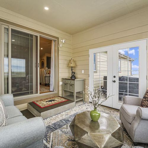 Slide from cozy sunroom vibes straight into the bubbling hot tub under the sky.