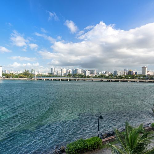 Unbeatable ocean vistas featuring a glimpse of San Juan's historic charm. History and horizon in one captivating view!