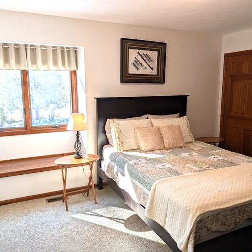 BEDROOM #4:  Features a queen-size, two dressers, a closet, nightstands, a lamp and private entrance to the second floor "jack and jill bathroom".