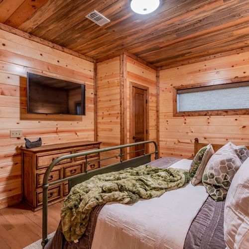 Equipped with an HDTV and a full bathroom to share with King Bedroom 2.