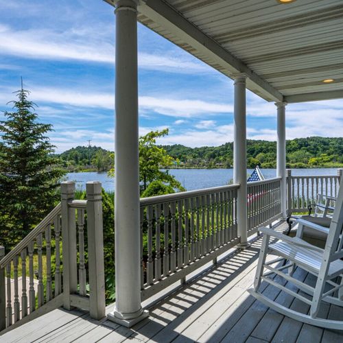 Exterior:  the fun front porch, with a great view of betsie lake!