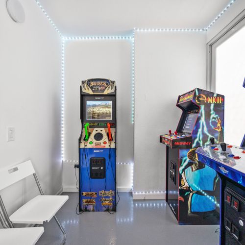 Get your game on in this vibrant arcade room with neon accents.