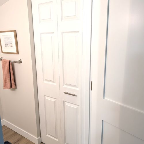 BATHROOM #2 (MAIN FLOOR):  This is a very convenient half-bathroom off of the kitchen.  It also includes a laundry closet with a stacked washer and dryer in it.