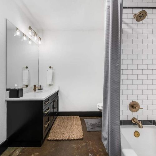 The bathroom connects to BR 2, tub and shower