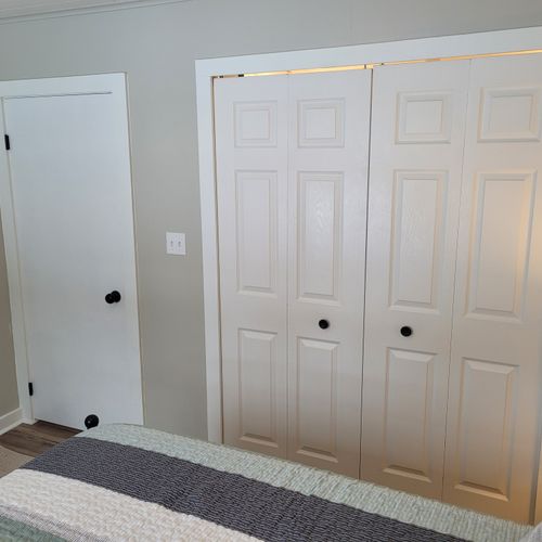 Bedroom #2:  features a queen-size bed, ceiling fan, nightstand, lamp, large closet, and 2 chairs.