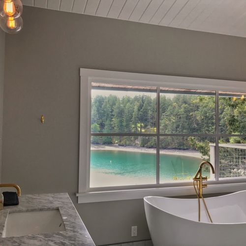 Master bedroom bathroom with Jack and Jill marble sink vanities and slipper tub