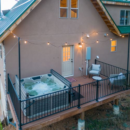 Melt in the hot tub under the twinkling lights after a day of exploring