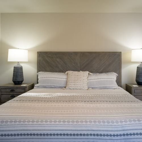 King bed with quality linens and pillows.