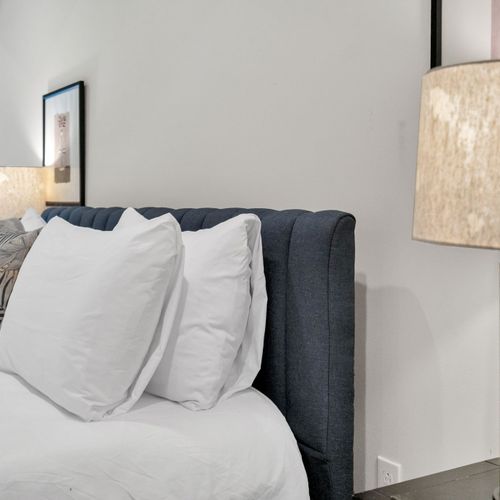 Sink into plush pillows w/ warm, soft lighting for a truly restful night.