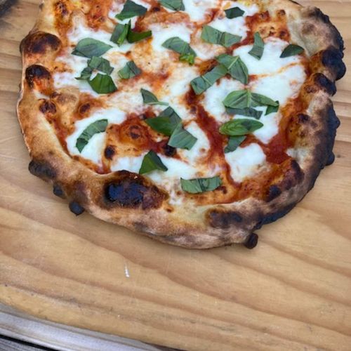 Handcrafted pizza baked in our wood-fired oven.