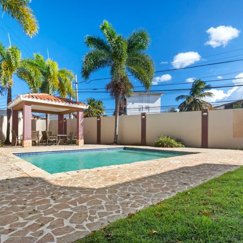 Your private oasis awaits! Enjoy sun-soaked days by the sparkling pool and lush garden, creating a perfect retreat for relaxation and fun.
