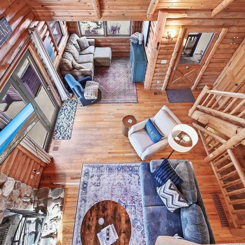 Living room:  the comfy living room with a huge wood fireplace!