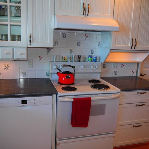 Kitchen:  the home has a large, beautiful, and very functional kitchen with all appliances including a dishwasher. There is a good supply of cooking and dining utensils included as well.