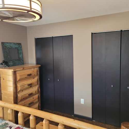 Bedroom #1 (second floor):  features a king-size bed, nightstands, lamps, closet, dresser, and ceiling fan.