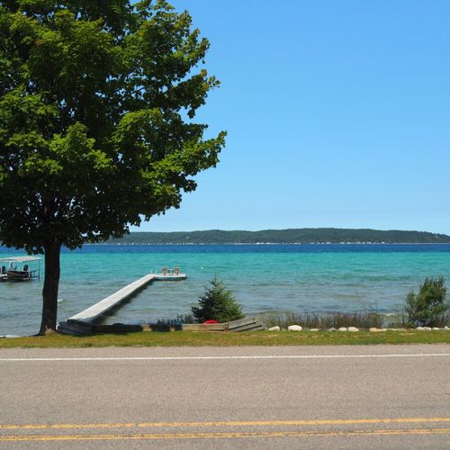 Exterior:  looking out at the lake from the front yard. (note that south shore drive runs between the house and the lake. )