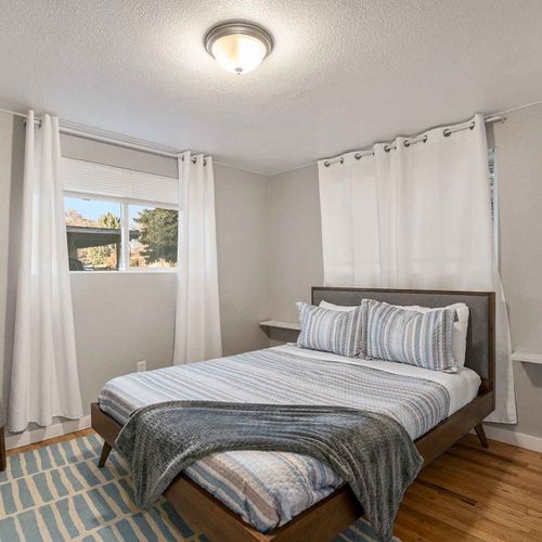 Indulge in well-deserved rest in the five well-appointed bedrooms, three upstairs and two in the lower level.