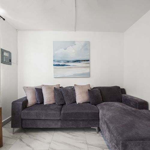 Inviting lounge space with ceiling fan.