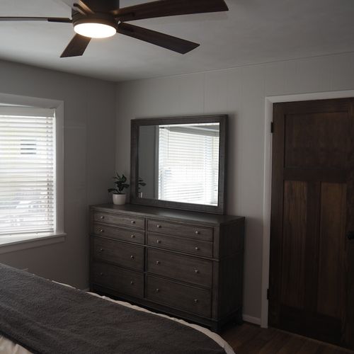 Bedroom #2 (first floor):  gorgeous master bedroom with queen-size bed, lakeview, walk-in closet, dresser, mirror, private a/c unit, ceiling fan, and private en suite bathroom. Located on first floor just off of the second living room.