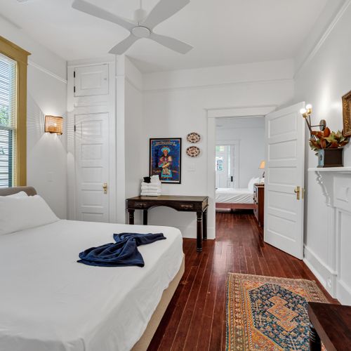 Classic bedroom w/ a clean, timeless feel and a pop of teal.