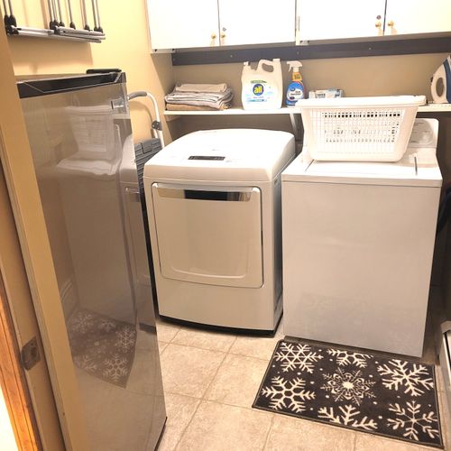 LAUNDRY ROOM (MAIN FLOOR):  The home has a very convenient laundry room, which also includes an additional refrigerator.  Note that the entrance to the laundry room is from within BEDROOM #1.